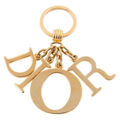 porte cle christian dior charms keyring gold bag|dior brooches.